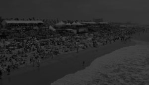Blacked out image of a beach full of sunbathers